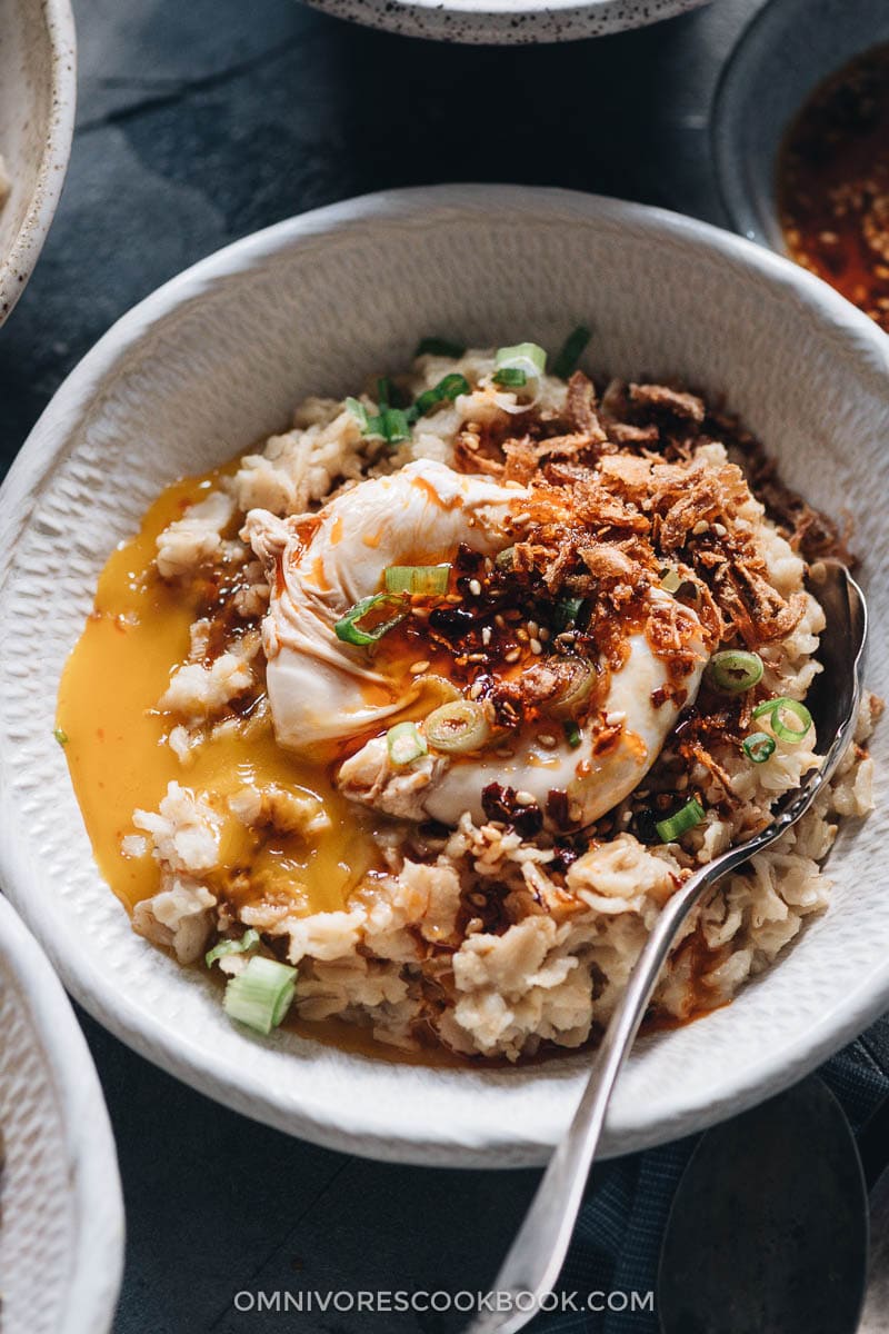 Savory oatmeal topped with egg close-up