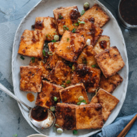 Crispy Marinated Tofu | This recipe generates the most flavorful marinated tofu! The tofu pieces are soaked in a savory spicy Asian sauce, then pan fried until crispy. It’s very easy to put together and yields crispy tofu bites that are bursting with flavor! {Vegan, Gluten-Free adaptable}
