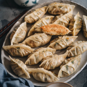 Turkey dumplings (A Thanksgiving Leftover Recipe) | Turn Thanksgiving leftovers into fancy dim sum using this turkey dumpling recipe. It uses leftover mashed potatoes, turkey, and cranberry sauce to make crispy, hearty, and juicy dumplings that are even better than takeout.