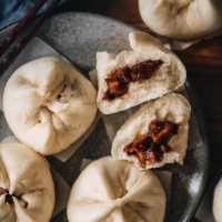 Char Siu Bao (Steamed BBQ Pork Buns) | Learn how to make authentic Chinese char siu bao just like a dim sum restaurant. The buns have very soft, fine, and fluffy bread with a juicy tender pork filling. My recipe includes detailed step-by-step photos and a video to help you achieve the best result in your own kitchen.