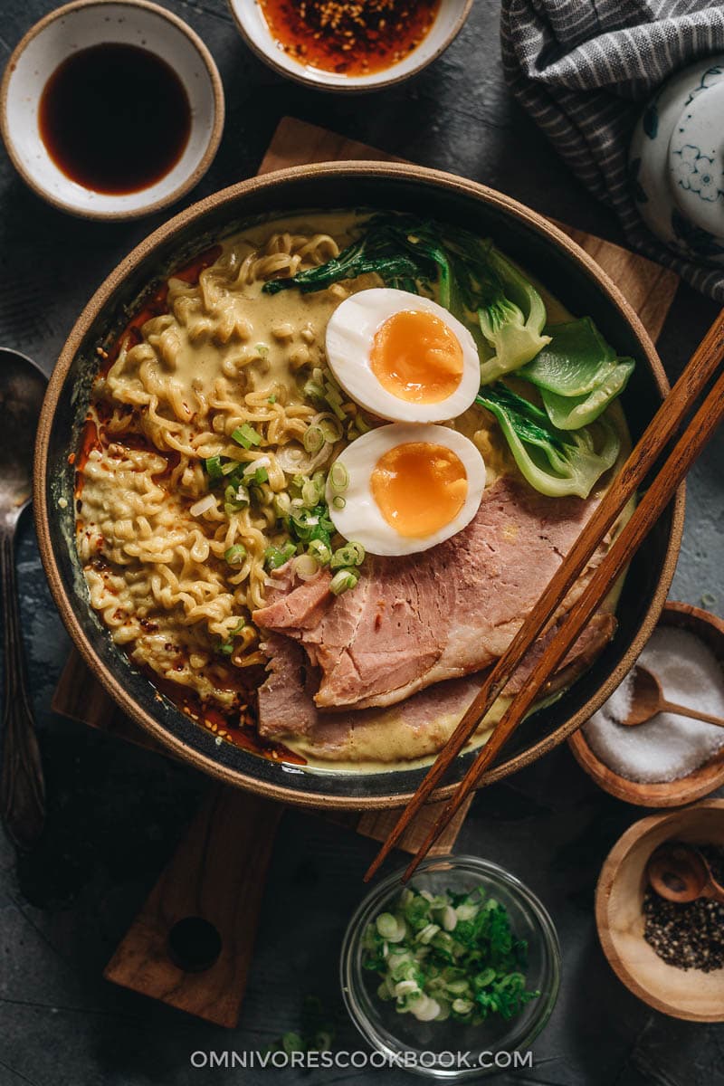 Ramen topped with ham, egg, and baby bok choy