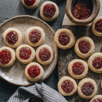 Strawberry Thumbprint Cookies | Buttery and soft cookies are filled with sticky star anise infused strawberry jam. It’s a super easy yet unique thumbprint cookies recipe that takes no time to put together. It’s perfect for Christmas, New Year, and other holiday.