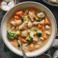 Creamy Chicken Sweet Potato Stew | This easy chicken sweet potato stew is a perfect one-pot dinner for a busy weeknight. Juicy chicken, tender root veggies, and crisp broccoli are cooked in a creamy, gingery sauce. It is easy to prepare, tastes so hearty, and is packed with nutrition. {Gluten-Free Adaptable}