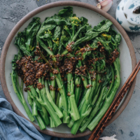 A super simple Choy Sum recipe that uses 5 ingredients to create a scrumptious side dish in 20 minutes. The choy sum is blanched until tender, then drizzled with a garlicky sauce that is savory and lightly sweet. It is a perfect dish to add nutrition and vibrant color to your dinner table. {Vegan}