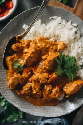 Butter chicken served over rice close-up