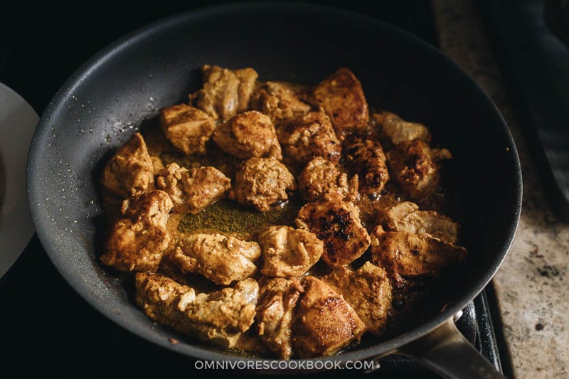 Browning chicken in a pan