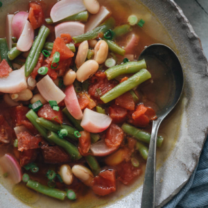 Vegetable soup with radish, green beans, and white beans