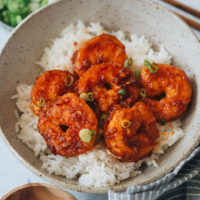 Spicy, garlicky, and sweet all at once, these crispy chili garlic shrimp will be your new favorite takeout dish at home in your own kitchen!