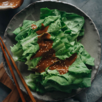 This refreshing and delicious appetizer, celtuce leaves salad, features a rich sesame sauce that will have you happily eating your veggies! {Vegan, Gluten-Free adaptable}