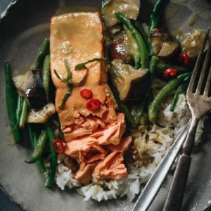 Salmon with green curry over rice