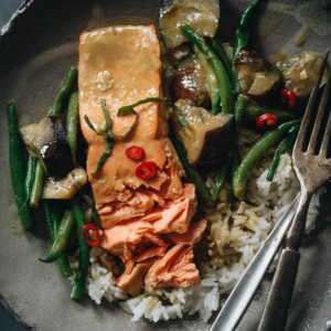 Delicious and balanced, this salmon curry features crispy skin and plenty of veggies in a creamy green coconut curry inspired by Thai cuisine. {Gluten-Free}