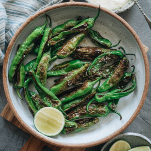 Make use of one of the best seasonal offerings with blistered shishito peppers using this quick and tasty way to enjoy their mellow and pungent flavor! {Gluten-Free, Vegan-Adaptable}