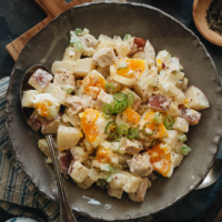 Turn any meal into a picnic with this creamy chicken potato salad. It’s loaded with chunks of tender potatoes, flavorful chicken, and soft-boiled eggs for a rich side! {Gluten-Free}