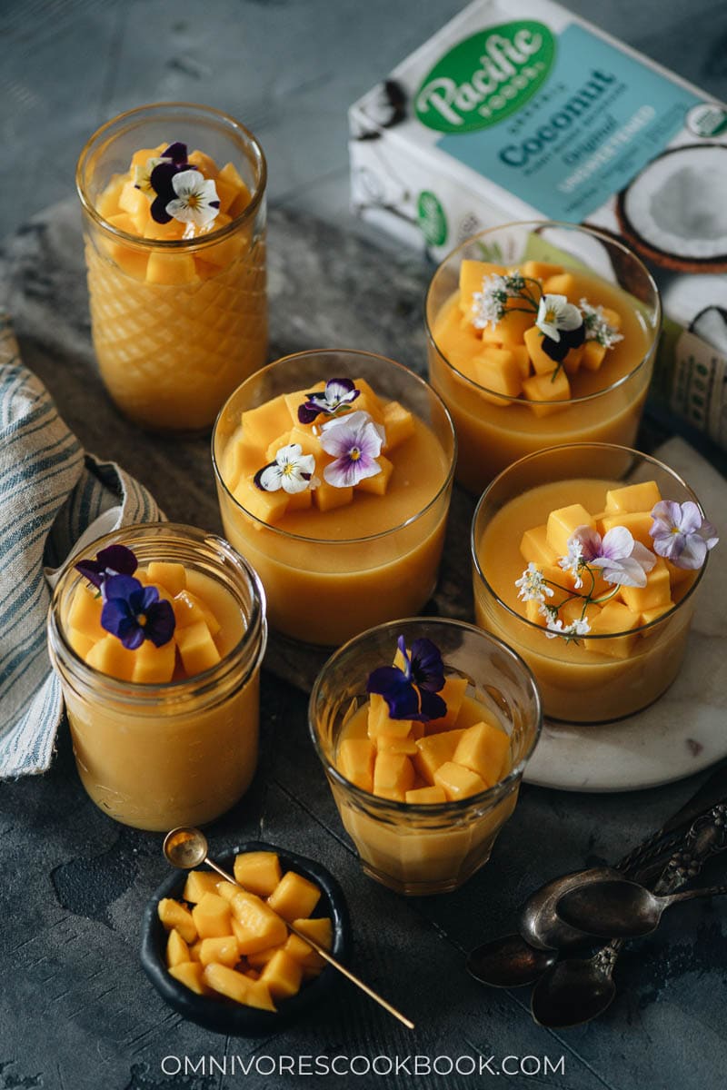 Mango puddings garnished with edible flowers