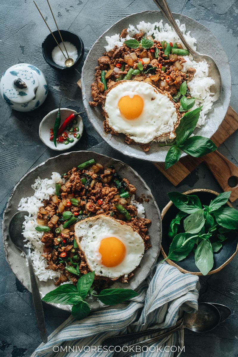 Thai basil chicken over rice with sunny eggs