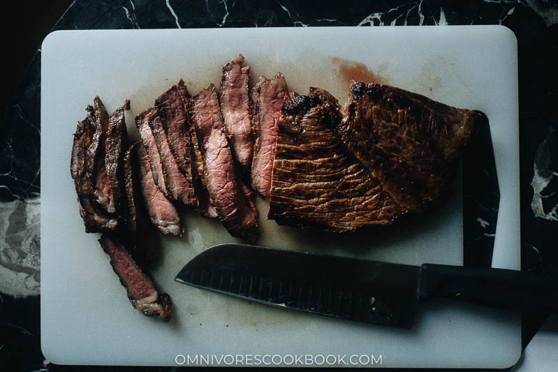 Carve cooked steak