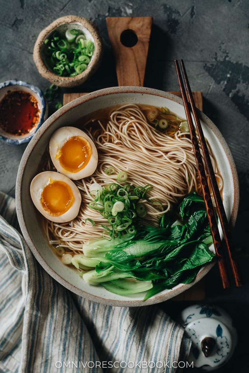 Soy sauce noodles topped with bok choy and egg