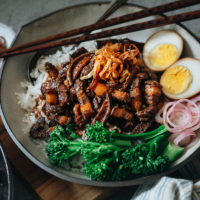 Take your taste buds to Taiwan with the classic one-bowl Lu Rou Fan: a dish of tender-braised pork belly with a rich and savory gravy, eggs, and veggies over steamed rice.