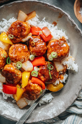 Meatballs with sweet and sour glaze over rice