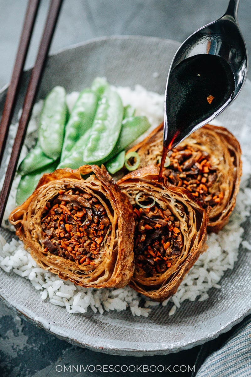 Vegan holiday loaf served over rice with sauce