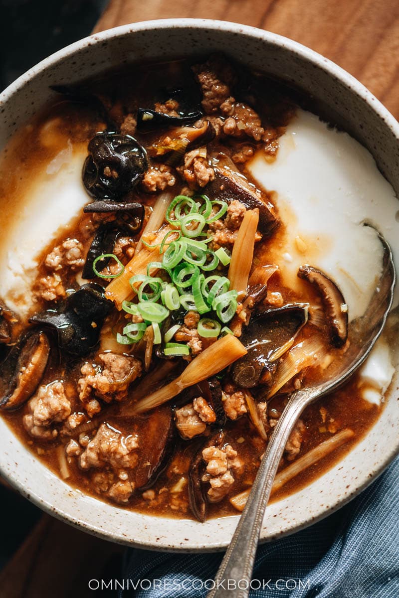 Savory tofu pudding (Dou Fu Nao) served with a brown sauce