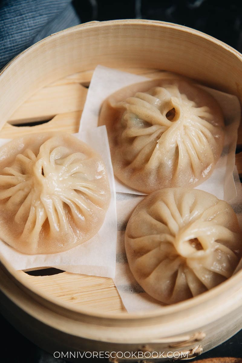 Cooked Xiao Long Bao in a bamboo steamer