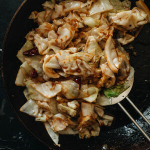 Chinese sauteed cabbage in a skillet