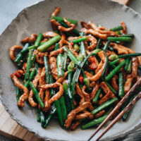 This easy home-style Chinese recipe combines tender stir-fried pork, bright green garlic chives, and a simple yet satisfying savory sauce.