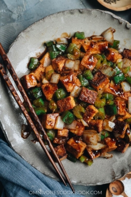 Close-up of crispy stir-fried tofu, green pepper, celery, and onion