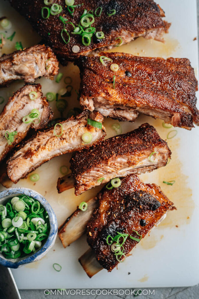 Juicy, spicy Chinese style pork ribs with sliced green onion