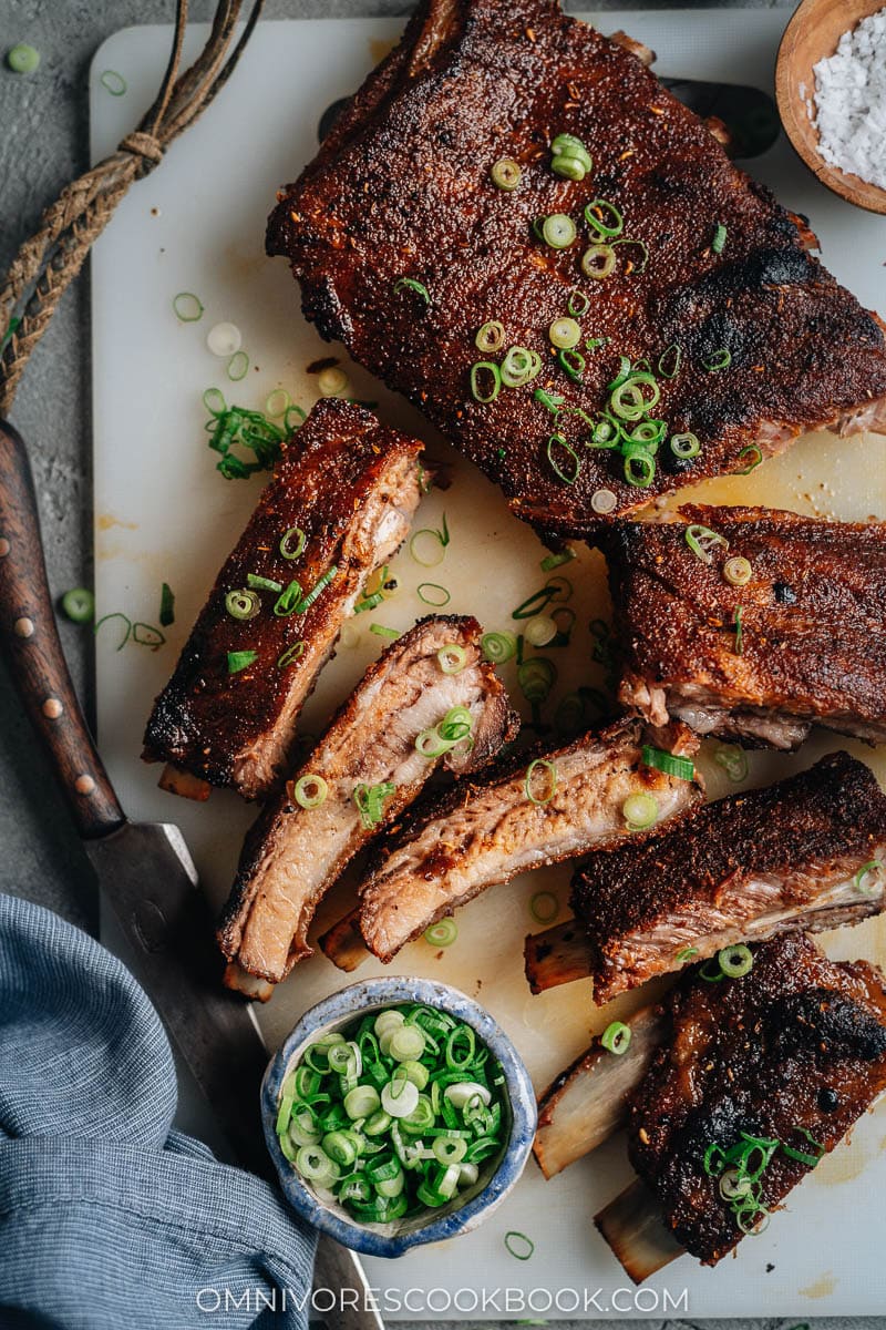 Tender, juicy dry rub pork ribs sliced on a cutting board