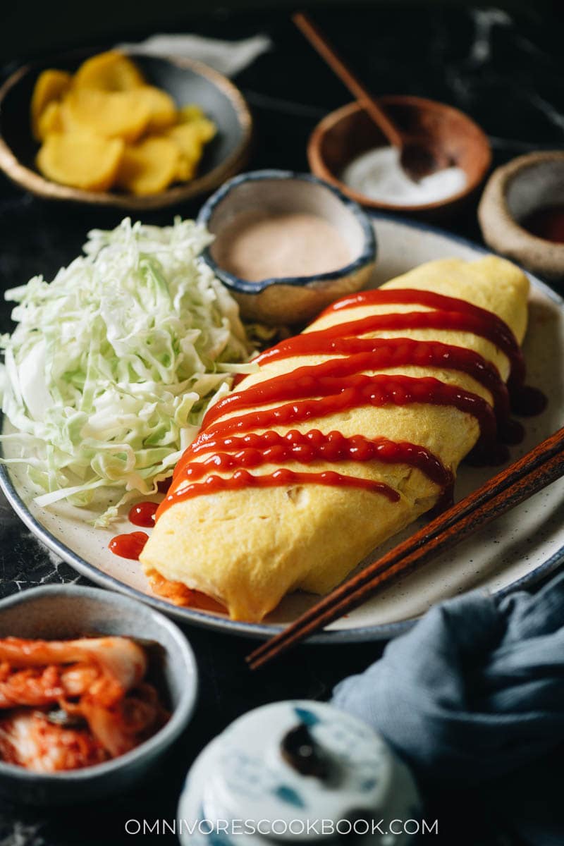 Omelet stuffed with kimchi fried rice on a plate