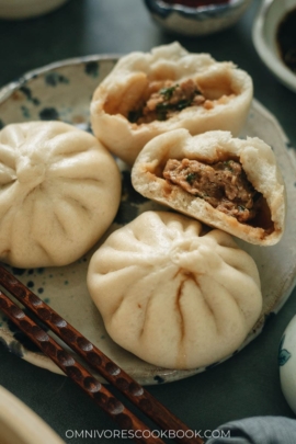 Fluffy steamed buns filled with juicy pork and Chinese chive