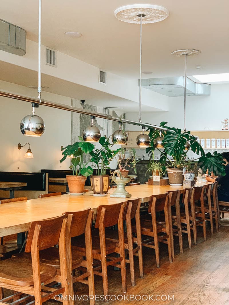 Birds of a Feather restaurant interior with a long table and chairs