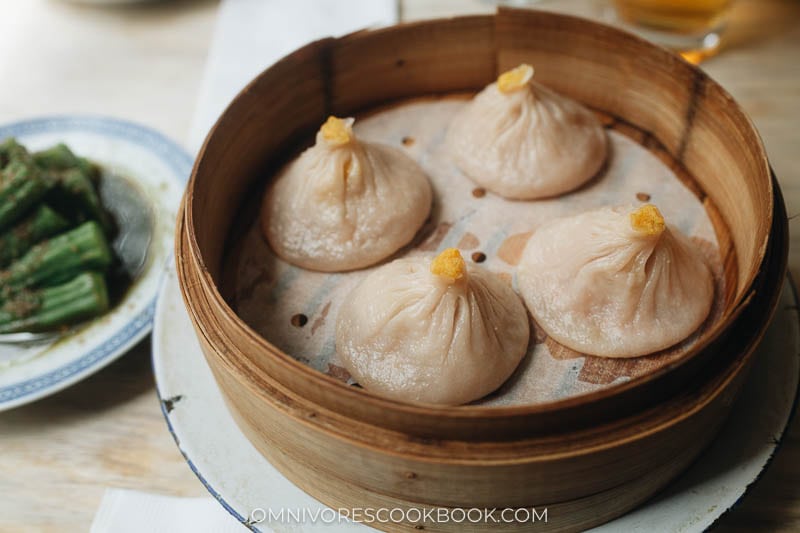 Shanghai-style soup dumplings in a bamboo steamer