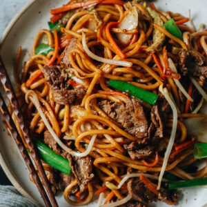 Authentic takeout-style beef lo mein with green onion