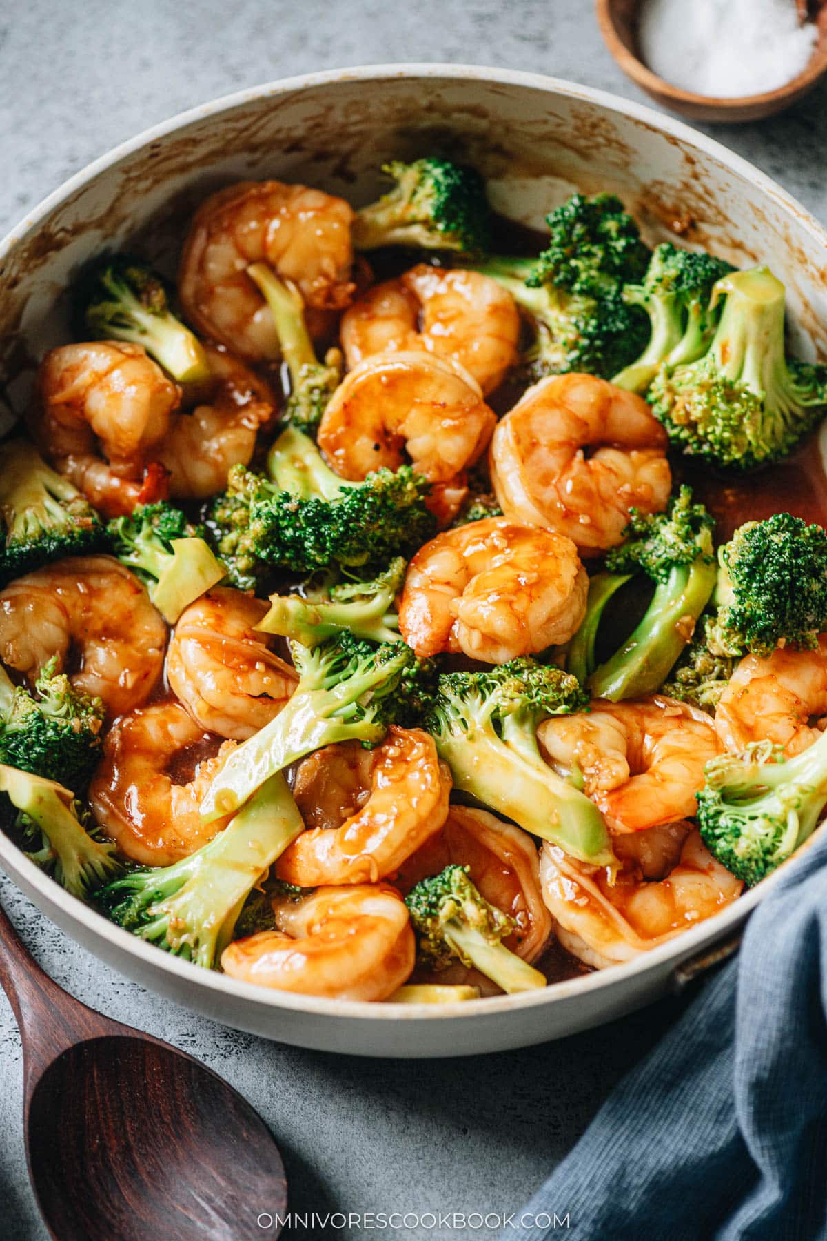 Chinese style shrimp in a skillet with green vegetables