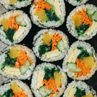 Vegetarian Kimbap is a Korean classic featuring egg, rice, and veggies rolled in seaweed. It’s both refreshing and satisfying and perfect for an appetizer, snack, or picnic. {Gluten-Free, Vegan-Adaptable}