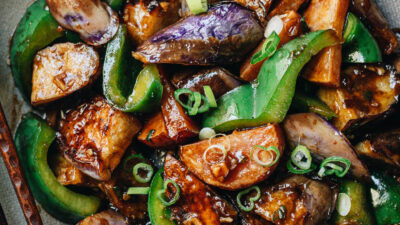 Stir fried eggplant, potato and pepper close up