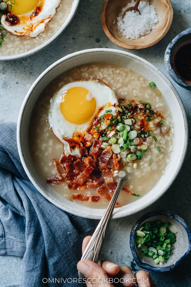 Porridge topped with bacon and egg
