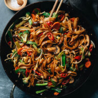 This vegan vegetable chow fun brings the fun to your meal with a bounty of vegetables in a rich and flavorful gingery sauce. {Gluten-Free Adaptable, Vegan}