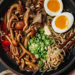Bowl of noodle soup with mushrooms and eggs