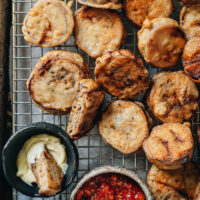 A Northern Chinese delicacy, these fried stuffed eggplants feature a juicy filling, tender eggplant, and a super crispy crust. It’s like fried dumplings, but using eggplant to replace the dough wrapper. This recipe shows you how to get the crust extra crispy so that it stays crispy for a long time, even after reheating. It is a perfect dish for dinner parties, holidays, and Chinese New Year.