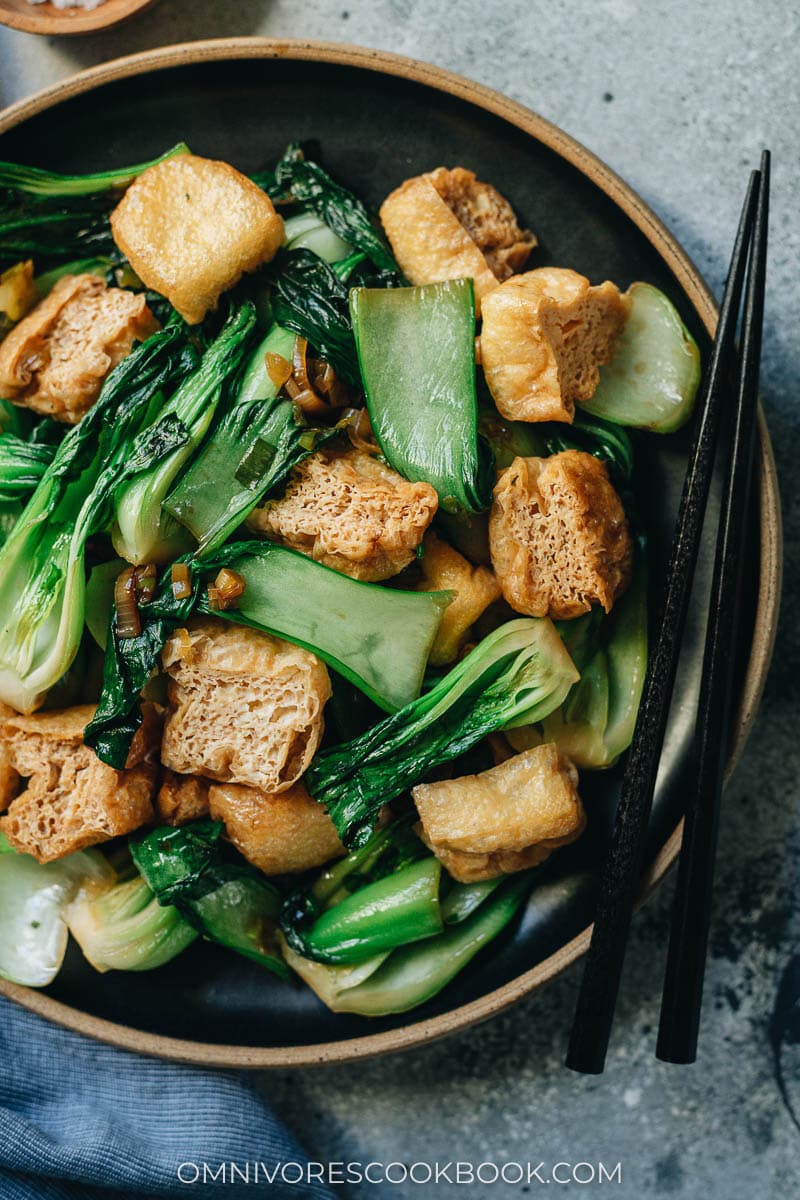 Stir fried bok choy with tofu puffs close up