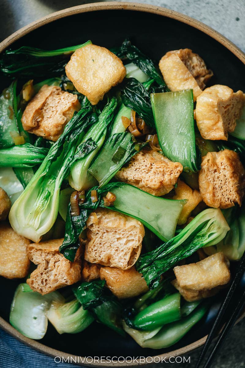 Chinese bok choy stir fry with fried tofu close up