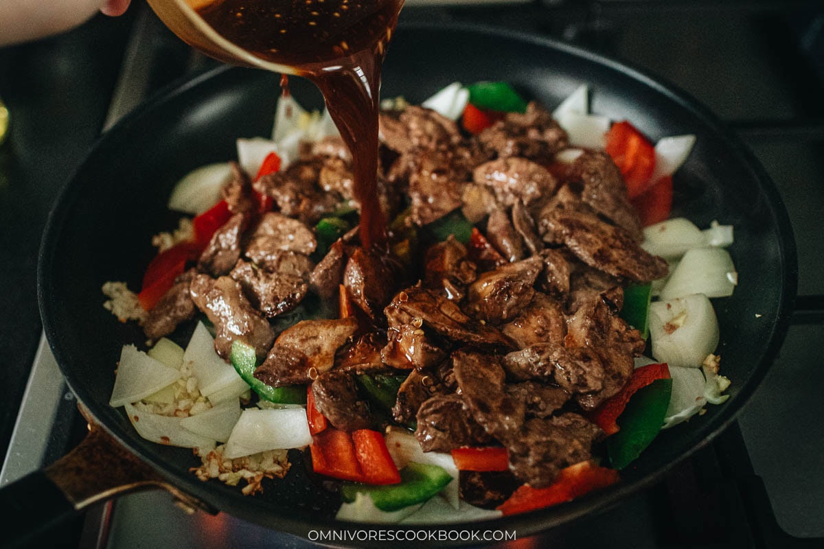 Adding the sauce to the pan