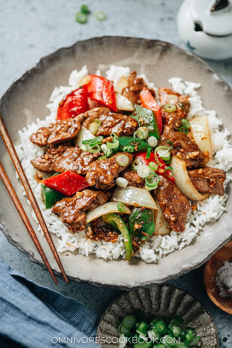 Stir fried chicken liver, onion and pepper over rice