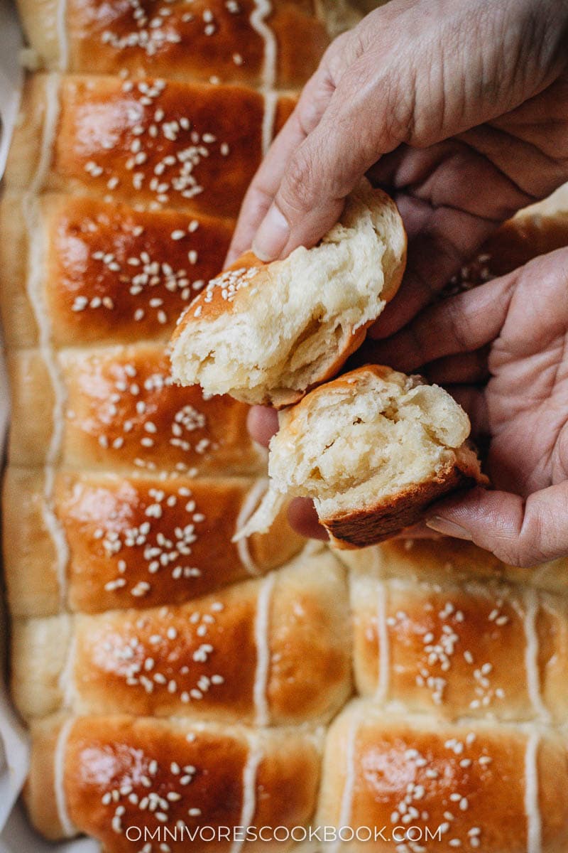 Breaking apart a coconut bun