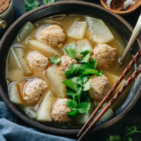 Winter melon soup is a soothing and comforting dish that is indispensable during the cold winter months. The winter melon is cooked in a fragrant broth until tender, with extra juicy pork meatballs that have a melt-in-your-mouth texture.The soup is very easy to prepare and tastes especially fulfilling. {Gluten-Free Adaptable}
