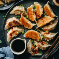 Introducing Northern Chinese pork and sauerkraut dumplings that have a savory, fragrant, juicy filling and a crispy crust. They are very easy to put together compared to other types of dumplings. They are also freezer friendly and therefore perfect for making ahead of time. Use this one as an appetizer for your multi-course meal or serve it as a main course for lunch!